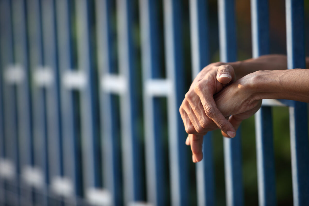 "Hands in prison"